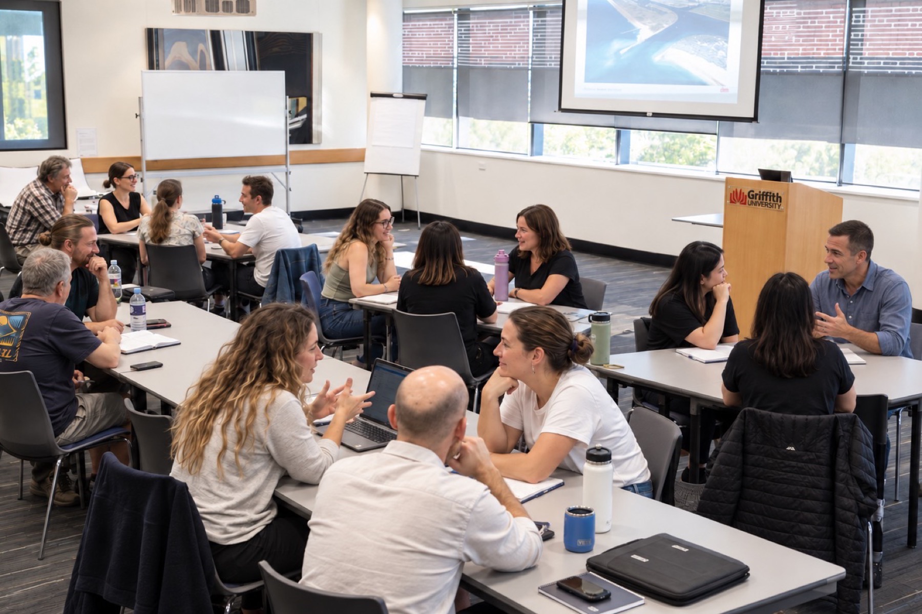 Participants working in small groups at the Coastal Resilience Short Course, Griffith University Gold Coast, August 2026